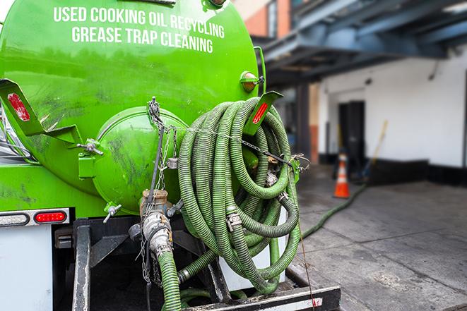 a large industrial grease trap being pumped out in Dana Point